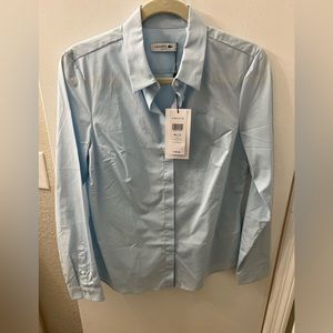 TWO Izod Lacoste button downs. Size 40/8. One shirt new w/tags. Both never worn.